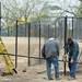 Workers install a portion of a new fence at Rolling Hills Metro Park. Melanie Maxwell I AnnArbor.com
